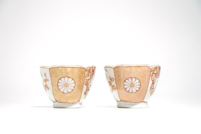 A pair of Chinese milk and blood quatrefoil cups and saucers, Kangxi