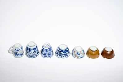 Seven Chinese blue and white, Imari style and famille rose cups and four saucers, Kangxi/Qianlong