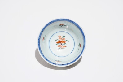 A Chinese Dutch-decorated Amsterdams bont cup and saucer with a tiger, Kangxi/Qianlong