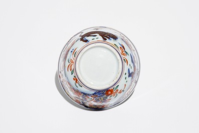 A Chinese Dutch-decorated Amsterdams bont cup and saucer with a tiger, Kangxi/Qianlong