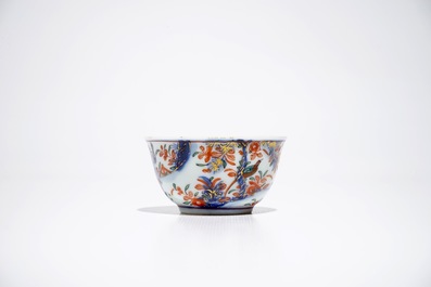A Chinese Dutch-decorated Amsterdams bont cup and saucer with a tiger, Kangxi/Qianlong