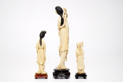 Three Chinese ivory figures on wooden bases, 19/20th C.