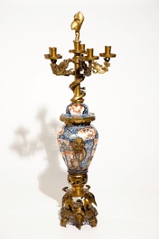 A large brass and gilt bronze-mounted Japanese Imari vase and cover candelabra, 19th C.