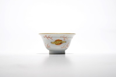 Seven Chinese iron red and gilt cups and saucers with dragons, Yongzheng/Qianlong