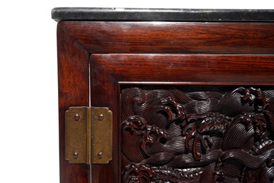 A Chinese two doors cabinet in hongmu and huanghuali with zitan dragon panels, 18/19th C.