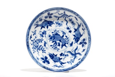 Eight Chinese blue and white cups and eleven saucers with fish, Kangxi