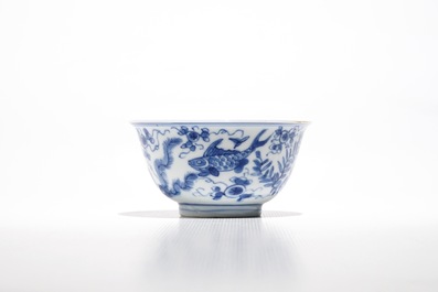 Eight Chinese blue and white cups and eleven saucers with fish, Kangxi