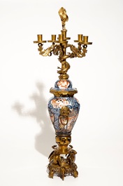 A large brass and gilt bronze-mounted Japanese Imari vase and cover candelabra, 19th C.