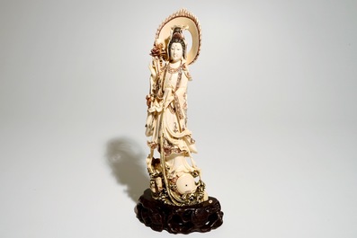 A Japanese ivory model of Guanyin on a carp, Taisho, ca. 1930, signed