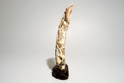 A Japanese ivory model of Guanyin on a carp, Taisho, ca. 1930, signed