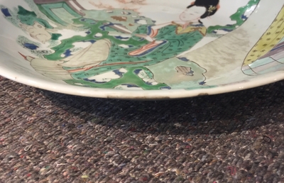 A Chinese famille verte plate with a lady in the garden, Kangxi mark and period