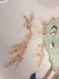 A Chinese famille verte plate with a lady in the garden, Kangxi mark and period