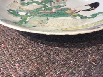 A Chinese famille verte plate with a lady in the garden, Kangxi mark and period