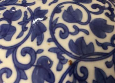A Chinese blue and white peony scroll vase, 19th C.