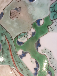 A Chinese famille verte plate with a lady in the garden, Kangxi mark and period