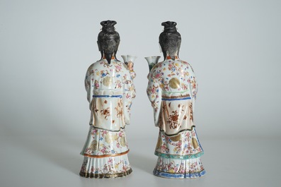 Two large Chinese famille rose candle holders modelled as court ladies, Qianlong