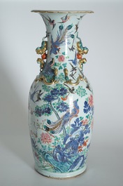 A very large Chinese famille rose vase with a peacock, 19th C.
