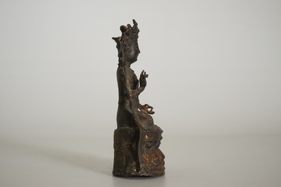 A Chinese laquered bronze figure of Guanyin, Ming