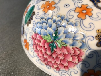 A pair of Chinese doucai bowls with floral famille rose medallions, 4-character mark, 19/20th C.