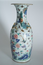 A very large Chinese famille rose vase with a peacock, 19th C.