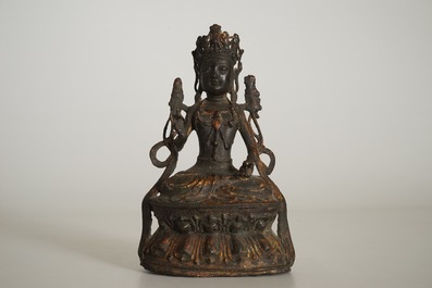 A Chinese laquered bronze figure of Guanyin, Ming