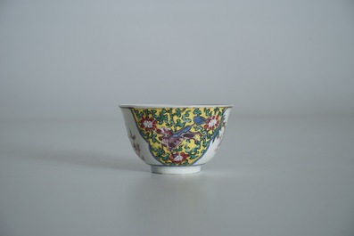 A Chinese famille rose cup and saucer, Yongzheng/Qianlong