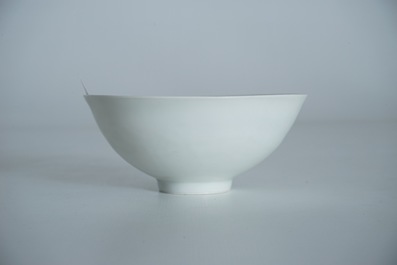 A Chinese monochrome white eggshell anhua bowl with applied design, Yongzheng mark, 19/20th C.