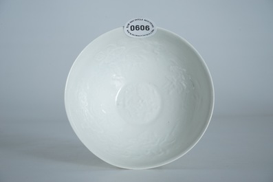 A Chinese monochrome white eggshell anhua bowl with applied design, Yongzheng mark, 19/20th C.