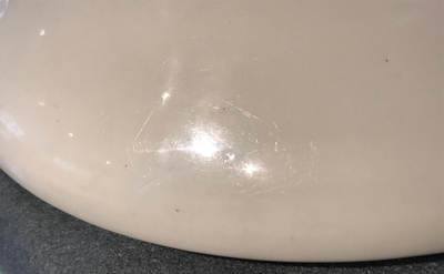 A Chinese Dehua blanc de Chine dish with incised floral design, Kangxi