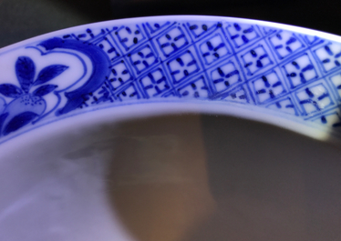 A Chinese blue and white klapmuts bowl with figural design, Xuande mark, Kangxi