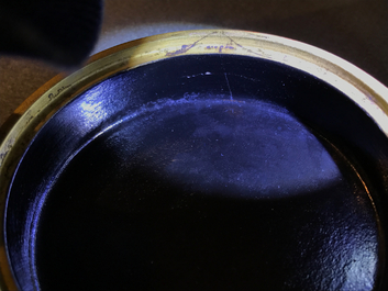 A Chinese porcelain imitation lacquerware covered box with prunus branches, 19/20th C.