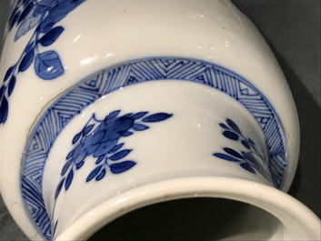 A Chinese blue and white rouleau vase with floral design, Kangxi