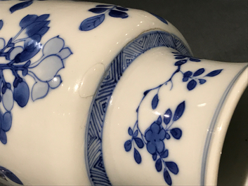 A Chinese blue and white rouleau vase with floral design, Kangxi