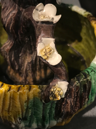 A Chinese verte biscuit brushwasher modelled as a treetrunk, Kangxi