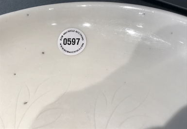 A Chinese Dehua blanc de Chine dish with incised floral design, Kangxi