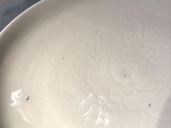 A Chinese Dehua blanc de Chine dish with incised floral design, Kangxi