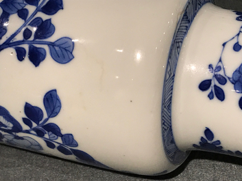 A Chinese blue and white rouleau vase with floral design, Kangxi