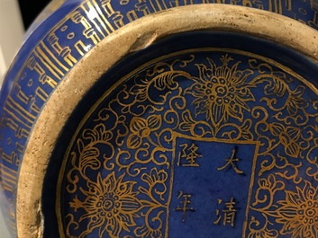 A pair of Chinese gilt-decorated powder blue-ground bottle vases, Qianlong mark, Guangxu