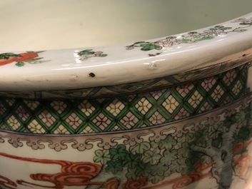 A Chinese famille verte fish bowl with figural design, 19th C.