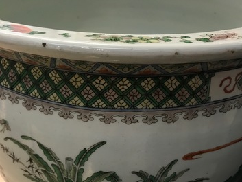 A Chinese famille verte fish bowl with figural design, 19th C.