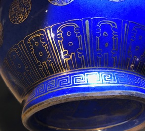 A pair of Chinese gilt-decorated powder blue-ground bottle vases, Qianlong mark, Guangxu