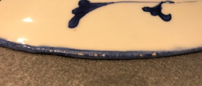 A Chinese blue and white plate with stylized floral design, Qianlong mark and period, minyao