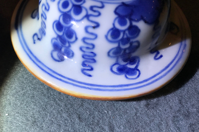 A pair of Chinese blue and white vases and covers with grapes, Kangxi