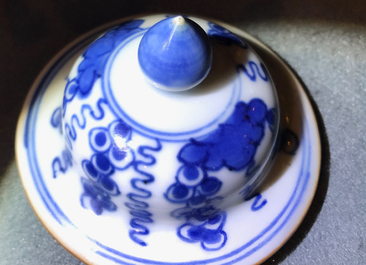 A pair of Chinese blue and white vases and covers with grapes, Kangxi