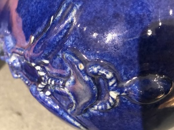 A Chinese blue and white hu powder blue-ground vase with landscape medallions, Qianlong mark, 19/20th C.