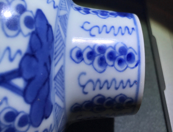 A pair of Chinese blue and white vases and covers with grapes, Kangxi