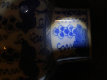 A pair of Chinese blue and white vases and covers with grapes, Kangxi