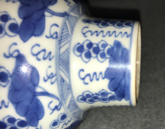 A pair of Chinese blue and white vases and covers with grapes, Kangxi