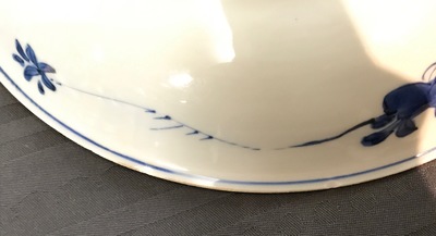 A Chinese blue and white dish with sanduo fruits among foliage, Kangxi