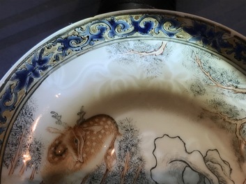 A Chinese anhua decorated cup and saucer with polychrome deer design, Yongzheng
